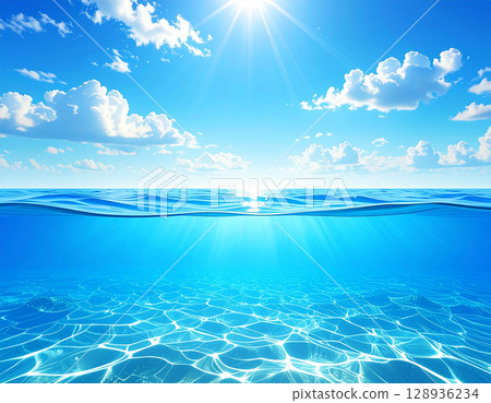 A blue sky with bright sunshine and clouds floating in it, and a sparkling ocean with a beautiful horizon 128936234