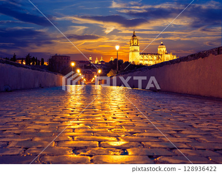 Salamanca sunset in roman bridge Tormes river 128936422