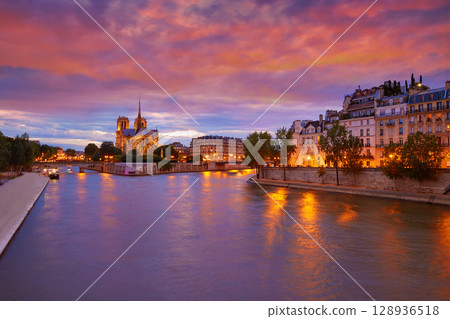 Notre Dame cathedral Paris sunset at Seine 128936518