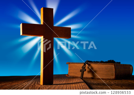 Christian wood cross on blue sky Christian wood cross on blue sky 128936533