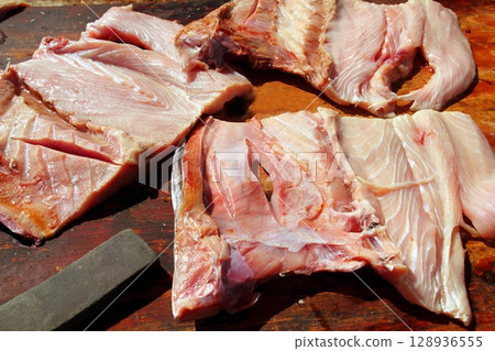 amberjack fish fillet on wood table 128936555