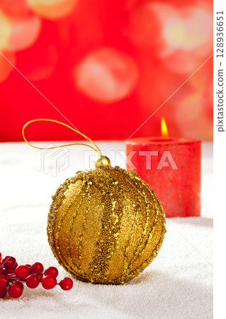 Christmas card of golden baubleand candle 128936651