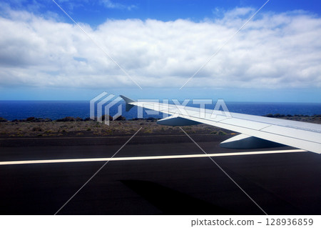 Airplane landing in canary Islands 128936859