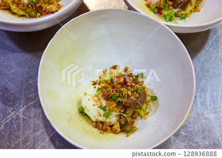 Low temperature slow cooking egg and meatball 128936888