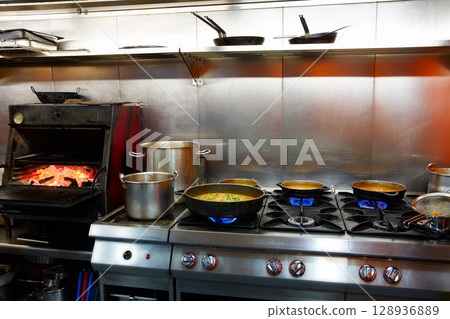 Mediterranean kitchen indoor with paella 128936889