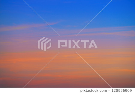 Sunset sky clouds orange and blue Sunset sky clouds orange and blue 128936909