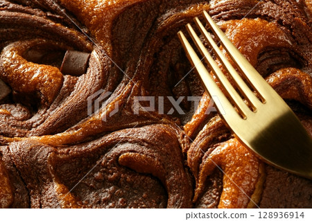 Chocolate cake crop macro texture, golden light Chocolate cake crop macro texture, golden light 128936914