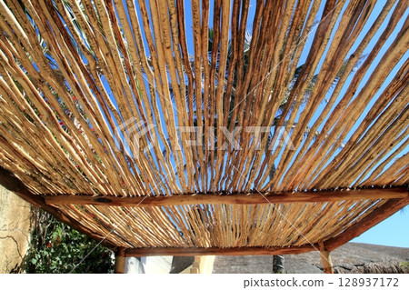 palapa tropical Mexico wood cabin roof detail 128937172