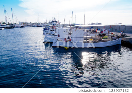 fishing boats at sunset in Formentera marina fishing boats at sunset in Formentera marina 128937182