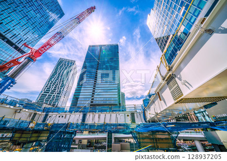 Tokyo cityscape, Japan. July 27th. Extremely hot... Steel beams assembled next to the Fukuras deck... Full-scale construction begins. 128937205