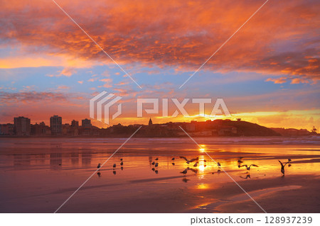 Gijon skyline sunset in San Lorenzo beach Asturias Gijon skyline sunset in San Lorenzo beach Asturias 128937239