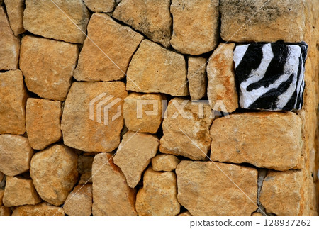 Unique, alone, one zebra texture painted stone Unique, alone, one zebra texture painted stone 128937262