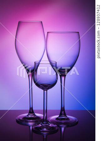 Three different wine glass on a color background 128937412