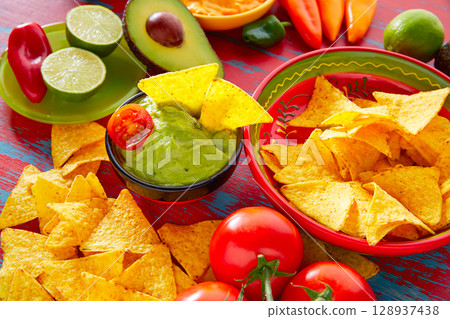 Mexican food nachos and guacamole chili sauce 128937438