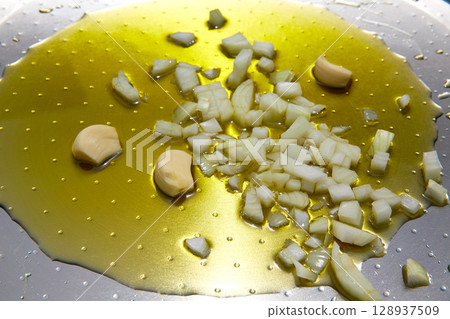 paella from spain recipe first step fry onion and garlic paella from spain recipe first step fry onion and garlic 128937509