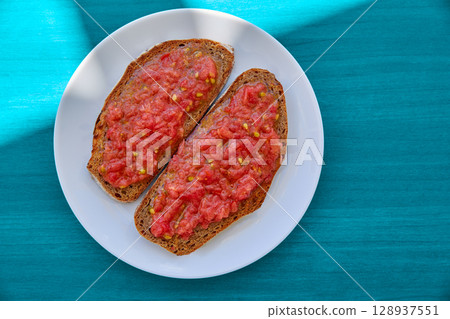 Bread toasted slices with grated tomato Bread toasted slices with grated tomato 128937551