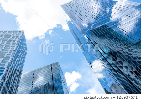 Landscape of the office town looking up at a skyscraper Landscape of the office town looking up at a skyscraper 128937671