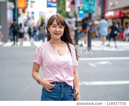 Young gal standing in the street 128937738