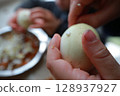 two child's hands cutting vegetables for salad close up 128937927