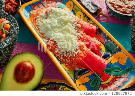 Red enchiladas Mexican food with guacamole Red enchiladas Mexican food with guacamole 128937973