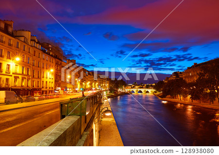 Paris Seine river sunset in France Saint Michel 128938080