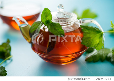 Aromatic herbal tea from mint and currant on a blue background 128939774
