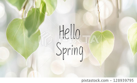 Hello spring greeting with fresh green leaves and blurred background 128939795