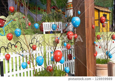Decorative Easter eggs hanging on tree branches. Decorative Easter eggs hanging on tree branches. 128939989