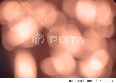 Abstract image featuring a warm bokeh effect with soft, glowing circular light orbs in golden. Dreamy atmosphere reminiscent of cozy evening lights or festive reflections, evoking a sense of warmth. Abstract image featuring a warm bokeh effect with soft, glowing circular light orbs in golden. Dreamy atmosphere reminiscent of cozy evening lights or festive reflections, evoking a sense of warmth. 128940445