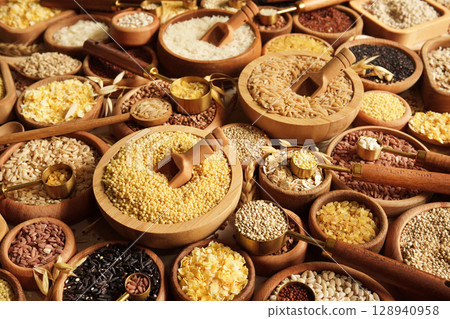 Colorful mix of grain varieties: oat and wheat, rice and millet, buckwheat and barley, quinoa and polenta. Food ingridients for healthy diet. Selective focus Colorful mix of grain varieties: oat and wheat, rice and millet, buckwheat and barley, quinoa and polenta. Food ingridients for healthy diet. Selective focus 128940958
