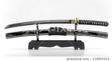 A beautiful Japanese sword and black sheath set that stand out against a white background A beautiful Japanese sword and black sheath set that stand out against a white background 128941029