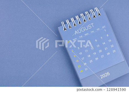August 2026 calendar on blue color background. Desk calendar for planning and organizing. August 2026 calendar on blue color background. Desk calendar for planning and organizing. 128941590