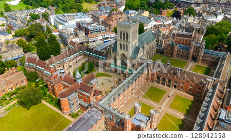 Cambridge University buildings and green lawns are viewed from above on a sunny summer day 128942158