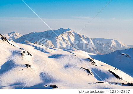 Mt. Yakushi and Mt. Murododaira dyed in the sunset - Climbing Mt. Tateyama and Mt. Betsuyama in the Northern Alps during the remaining snow season Mt. Yakushi and Mt. Murododaira dyed in the sunset - Climbing Mt. Tateyama and Mt. Betsuyama in the Northern Alps during the remaining snow season 128942837