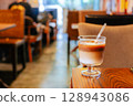 Iced Latte Moment in a Cozy Book Cafe 128943086