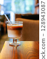Iced Latte Moment in a Cozy Book Cafe 128943087