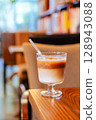 Iced Latte Moment in a Cozy Book Cafe 128943088