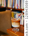 Iced Latte Moment in a Cozy Book Cafe 128943089