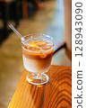 Iced Latte Moment in a Cozy Book Cafe 128943090