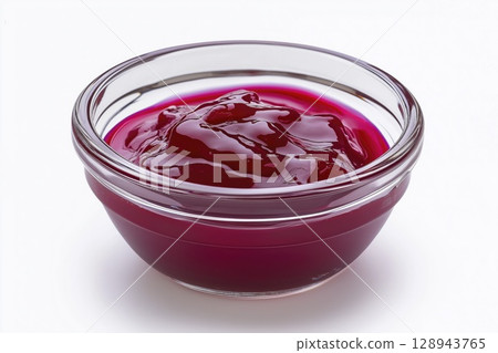 Glass bowl with red fruit jam isolated on white background, copy space 128943765
