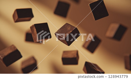 Falling broken chocolate bar pieces, background with copy space 128943779