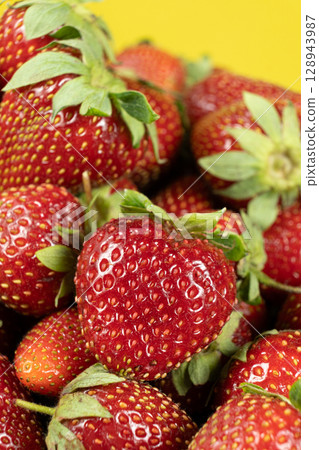 Ripe strawberries background. Sweet seasonal fruit concept. 128943987