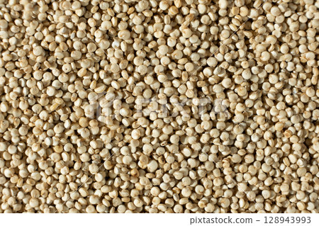 Macro Top View of Uncooked White Quinoa. Healthy Grain Background. Macro Top View of Uncooked White Quinoa. Healthy Grain Background. 128943993