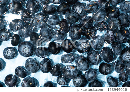 Top View of Blueberries Splashing in Water Top View of Blueberries Splashing in Water 128944026