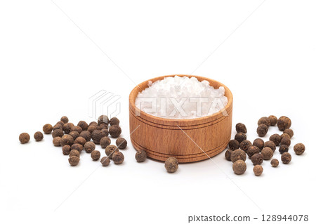 Bowl of salt and black pepper isolated on white background 128944078