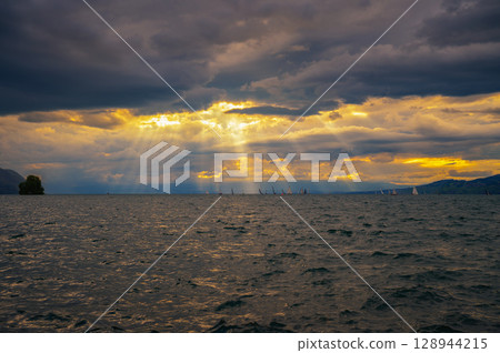 Sailboats Under Sunset Sky on Lake Geneva, Switzerland 128944215