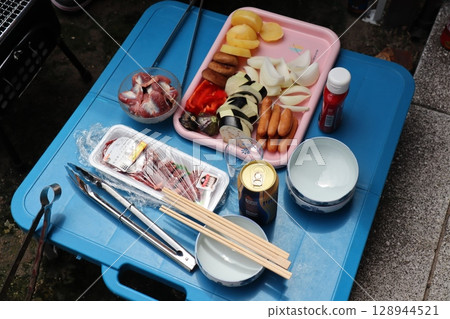 Getting ready for a barbecue in the garden Getting ready for a barbecue in the garden 128944521