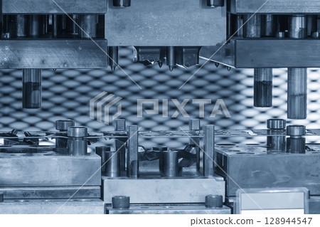 The metal parts mass production by progressive die in the light blue scene. 128944547