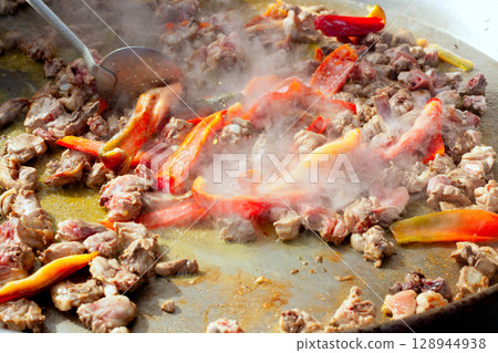 Paella from Spain first steps cooking big pan Paella from Spain first steps cooking big pan 128944938