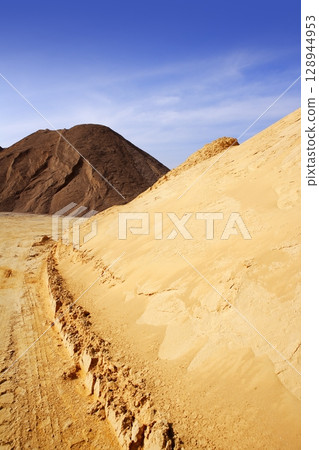 sand quarry mounds of varied sands color 128944953